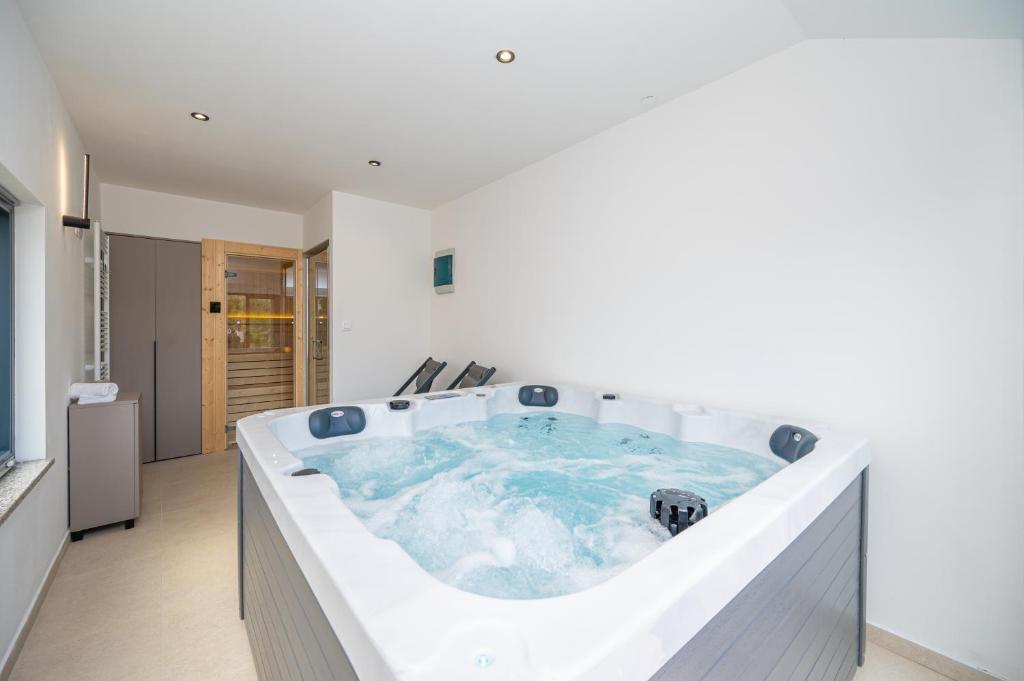 a jacuzzi tub in the middle of a room at Holiday home Mirage in Sukošan