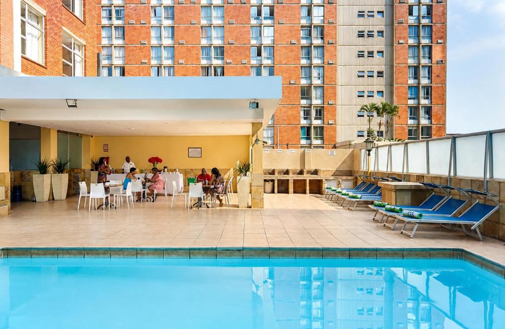 a pool on the roof of a building at Oceanic Apartment - City and Stadium Views3 - Self-Catering in Durban