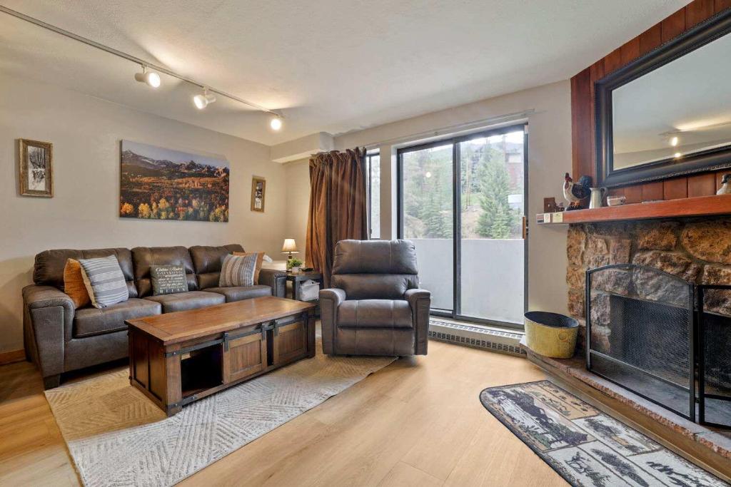 a living room with a couch and a fireplace at Beaver Run 1 Bedroom Condo in Breckenridge