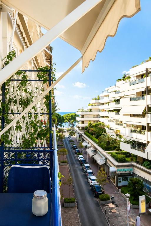 a balcony with a view of a street and buildings at Cannes - Modern balcony flat perfect location in Cannes