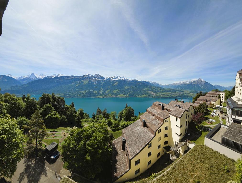 an aerial view of the lake and mountains at Beatenberg Alpine Residence in Beatenberg