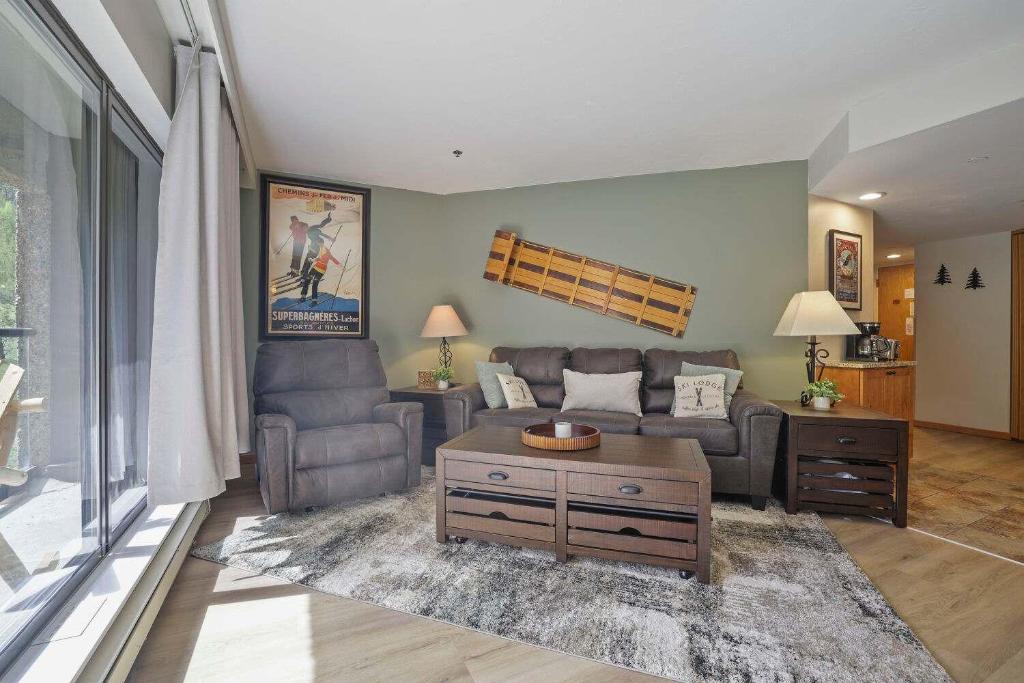 a living room with a couch and a table at Beaver Run Resort 4228 - Dog Friendly in Breckenridge