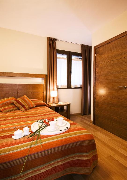 Voodi või voodid majutusasutuse Apartaments Petit Saüc toas