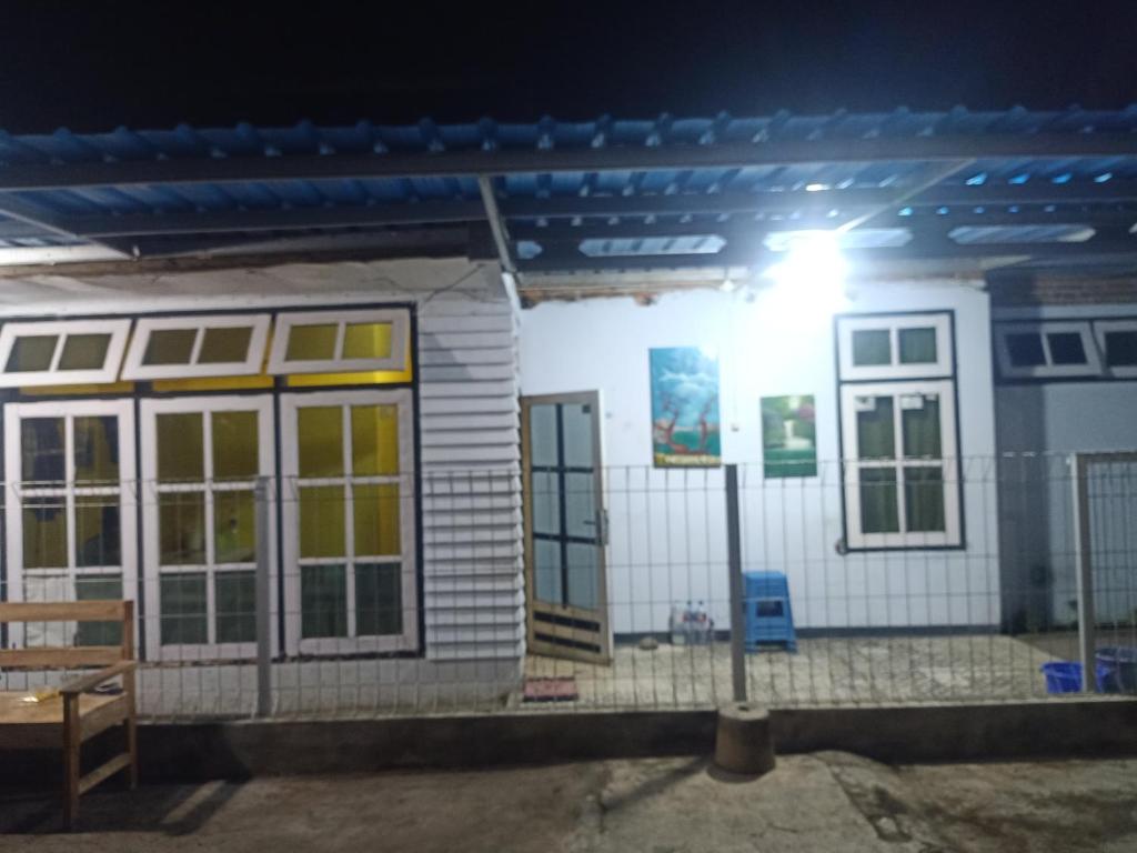 a small house with a light in front of it at Wahid Homestay in Ketapang