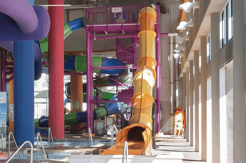 a large indoor water park with a water slide at Dunes Village in Myrtle Beach