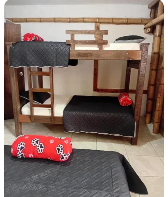 a bedroom with two bunk beds and a pillow at Guaduales Apartamento in Salento