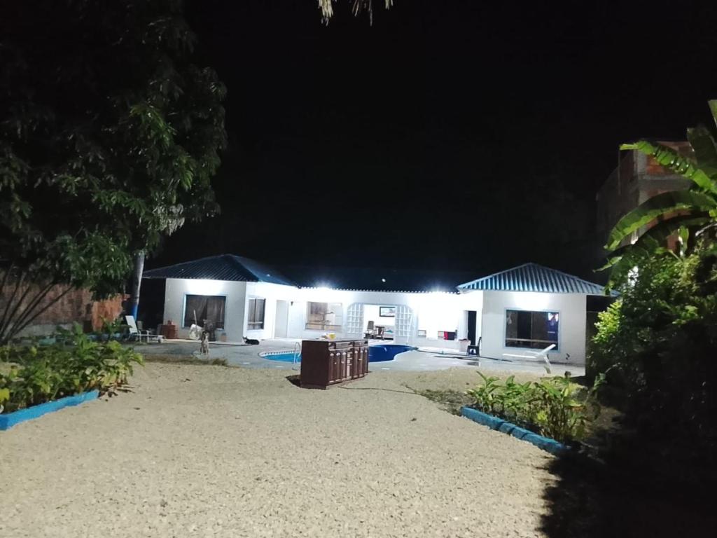 a house at night with lights on it at Finca los carrangueros in Apulo