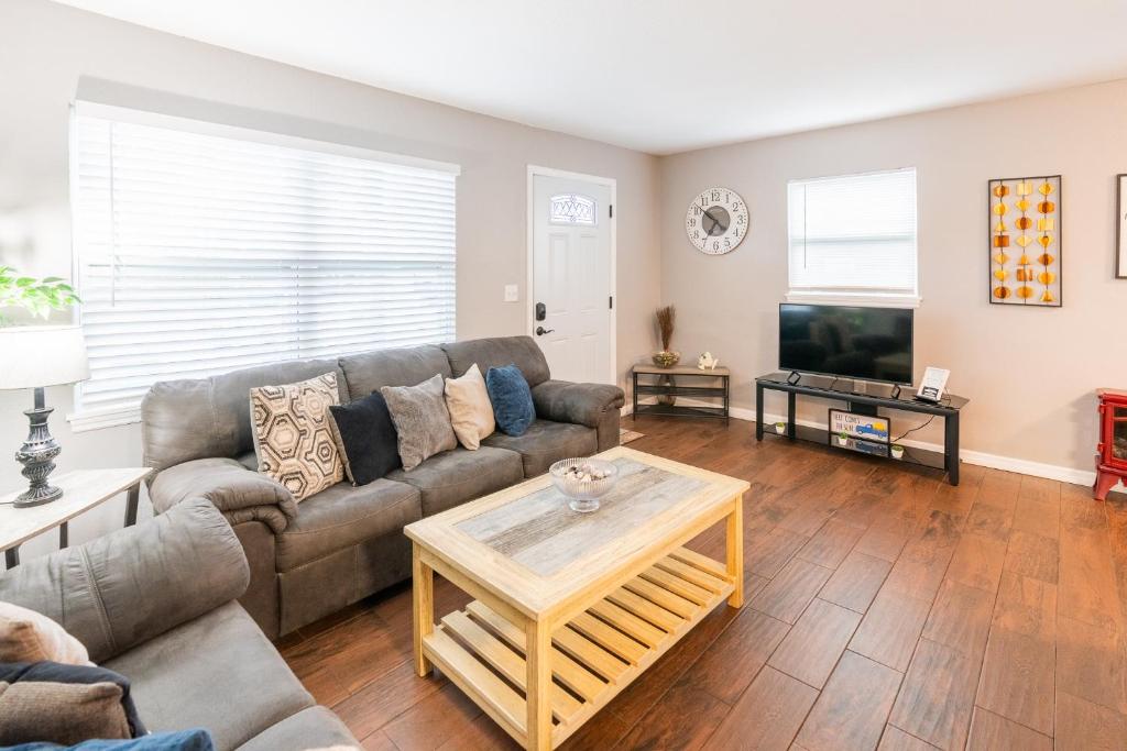 a living room with a couch and a table at The Cocoa Cove in Cocoa