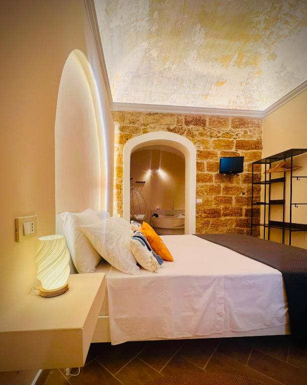 a child laying on a bed in a room at Vicolo 25 in Cinisi
