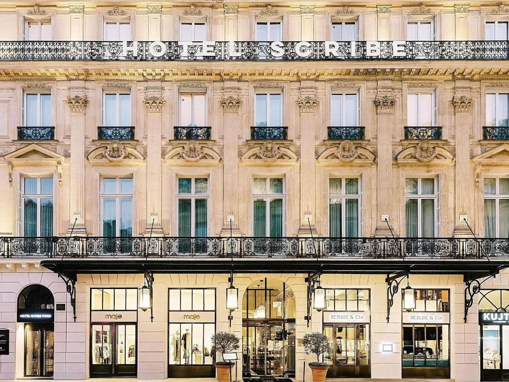 a facade of a building with windows and balconies at Sofitel Le Scribe Paris Opera in Paris