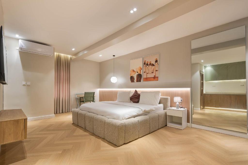 a bedroom with a bed and a television in it at The District Lekki by GCI in Lekki Phase 1