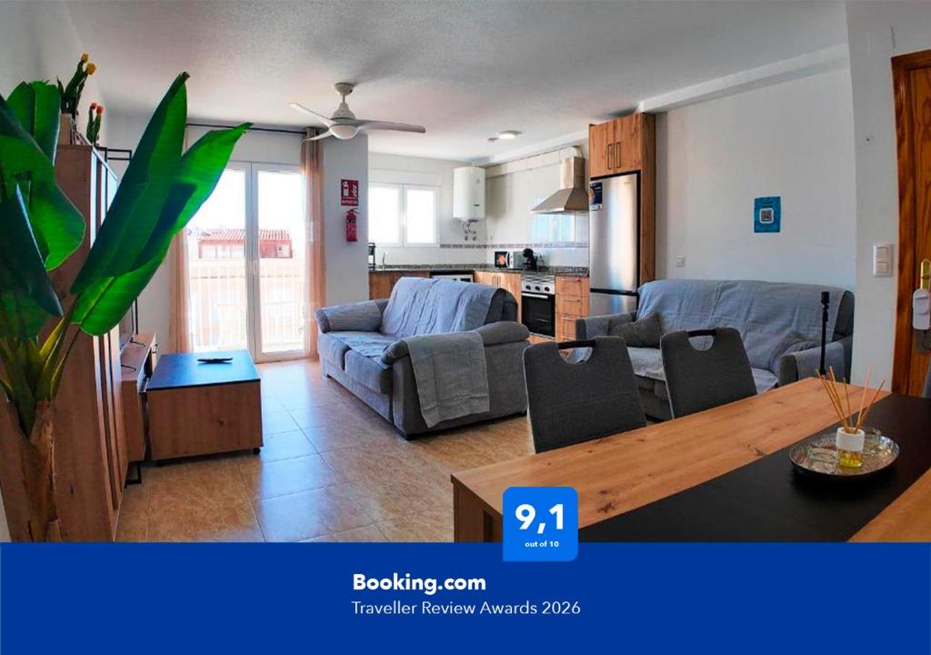 a living room with a couch and a table at Apartalux Star Magic I in Águilas