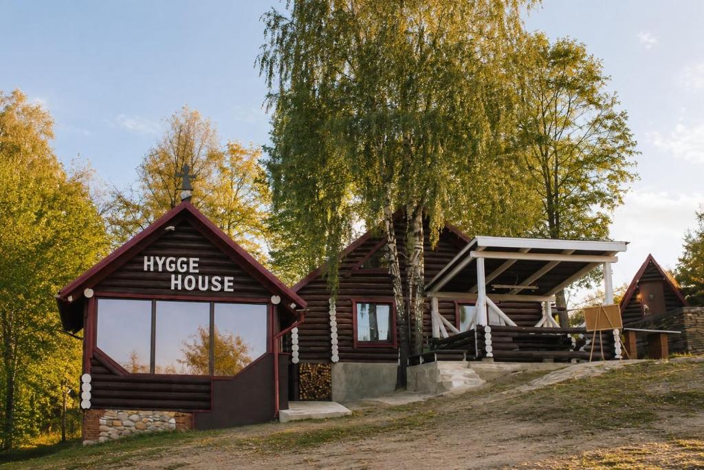 a log house with a sign that reads interest house at Hygge House in Vyshka
