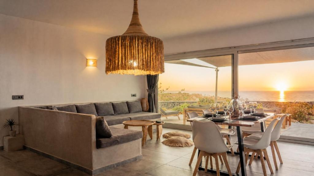 a living room with a couch and a table at Erimo Vip in Vourvoúlos