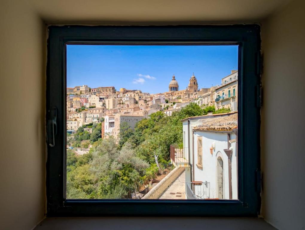 a view of a city from a window at Lues Garden in Ragusa