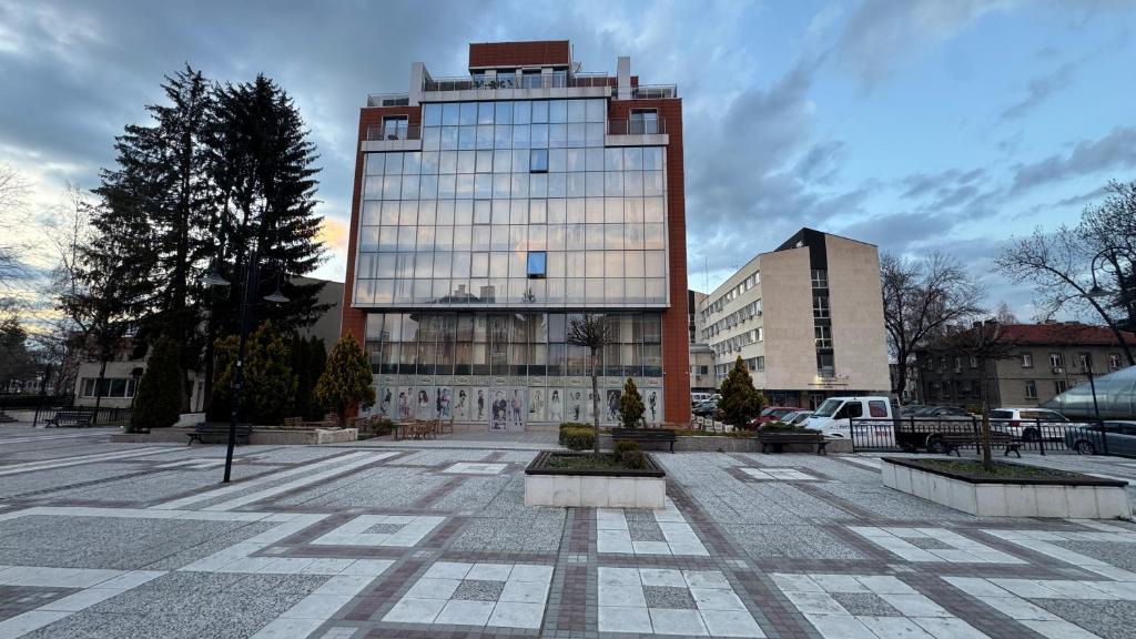 a tall building with a lot of windows at Апартамент 503 in Samokov