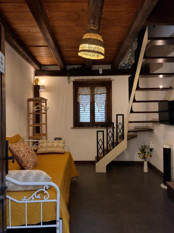 a bedroom with a bed and a staircase in a room at Sale34 in Marsala