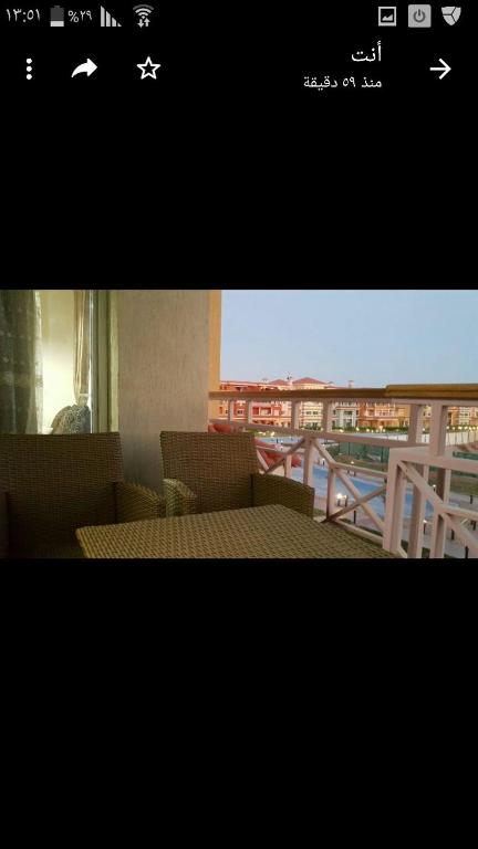 a picture of a balcony with a table and chairs at Chalet in sharm el shekh in Sharm El Sheikh