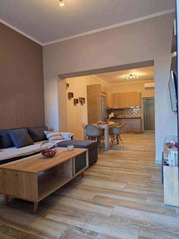 a living room with a couch and a table at Apartment Belle Epoque in Lixouri
