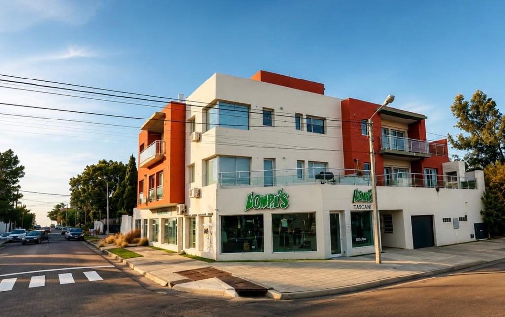 a building on the corner of a street at House51 "ubicado a solo 3 cuadras de la playa en pleno centro de Rada Tilly" in Rada Tilly