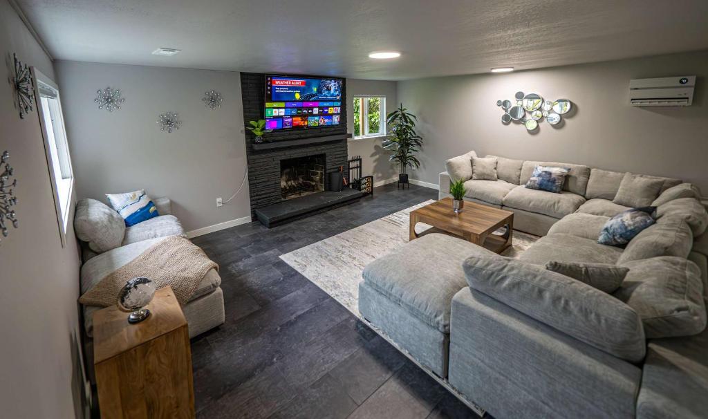 a living room with two couches and a fireplace at Remodeled 2BR, Chic and Cozy in Shoreline