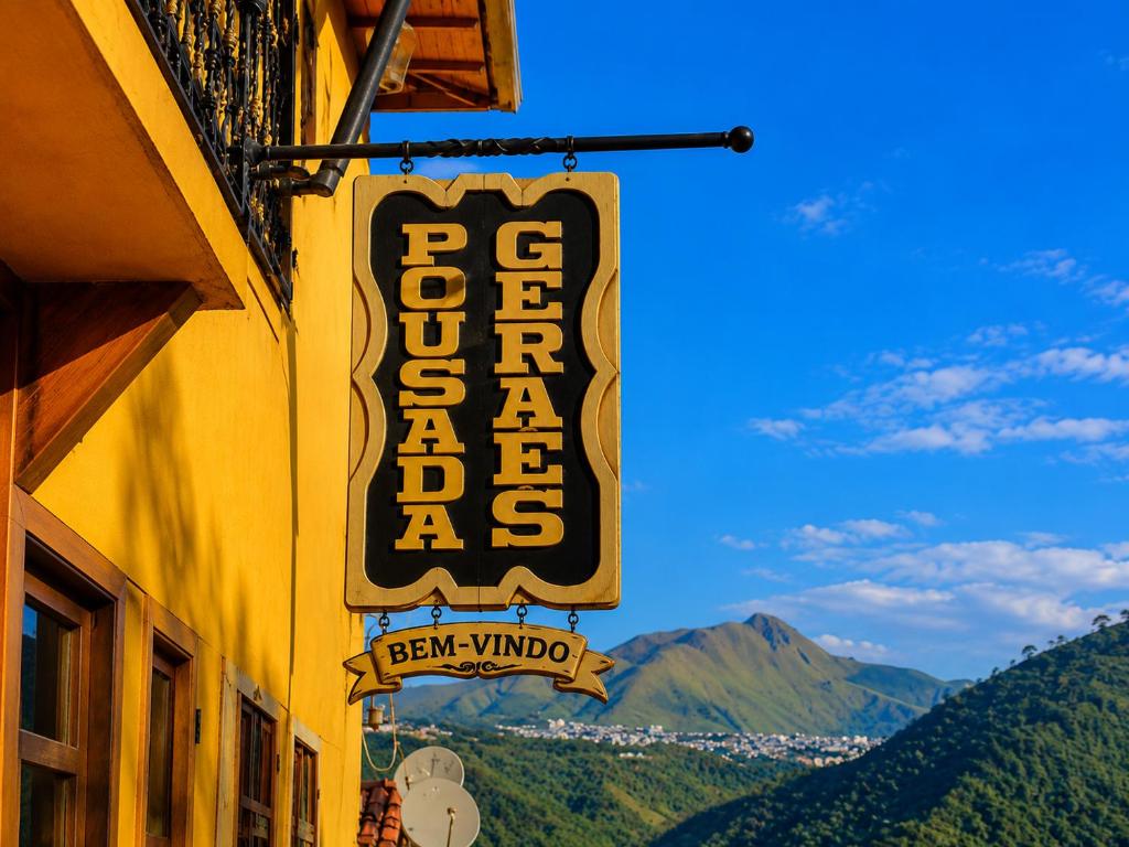 a sign for a bar window on the side of a building at Pousada Geraes in Ouro Preto