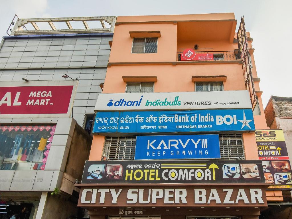 a building with signs on the side of it at Super Hotel O Priyal Amrit Sagar in Rourkela