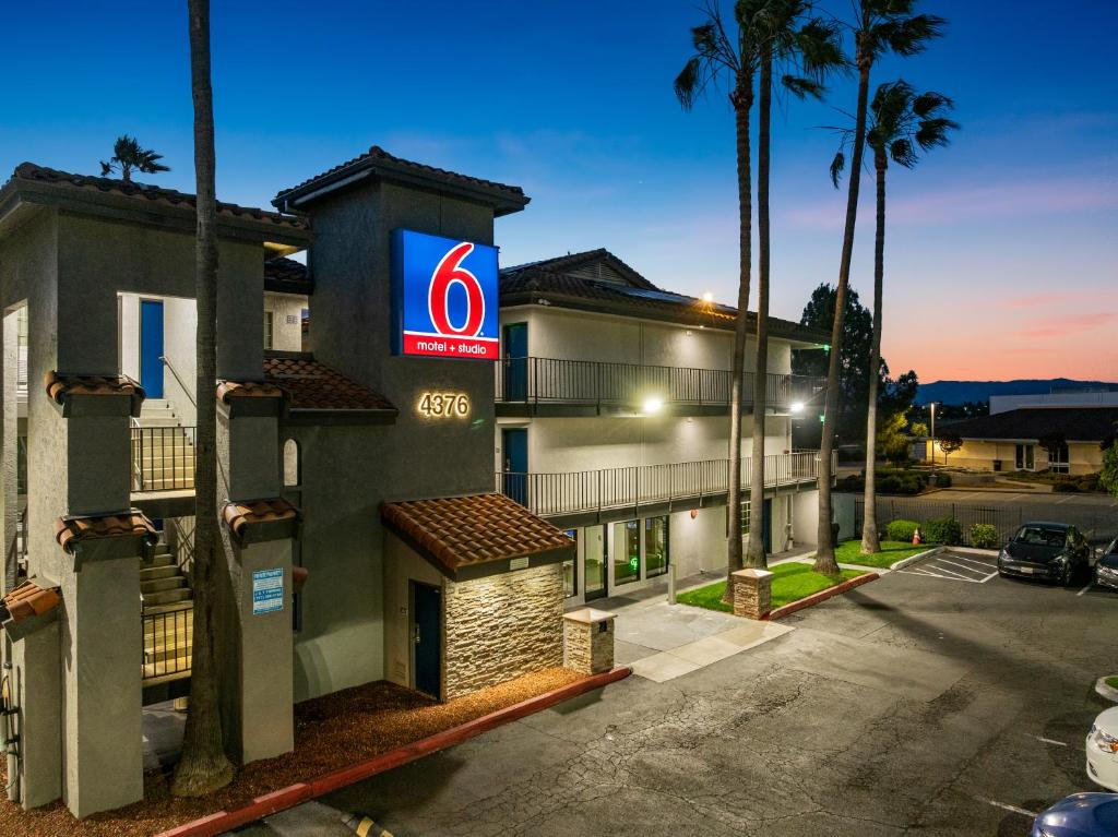 a hotel with a sign on the side of a building at Studio 6-Fairfield, CA - Napa Valley in Fairfield