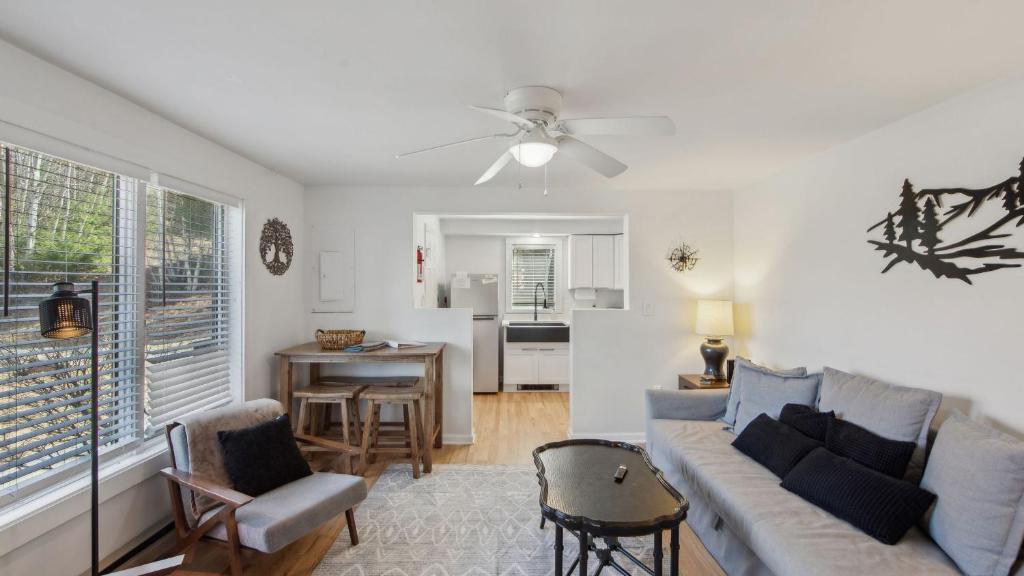a living room with a couch and a table at Sleeping Bear by AvantStay in North Creek