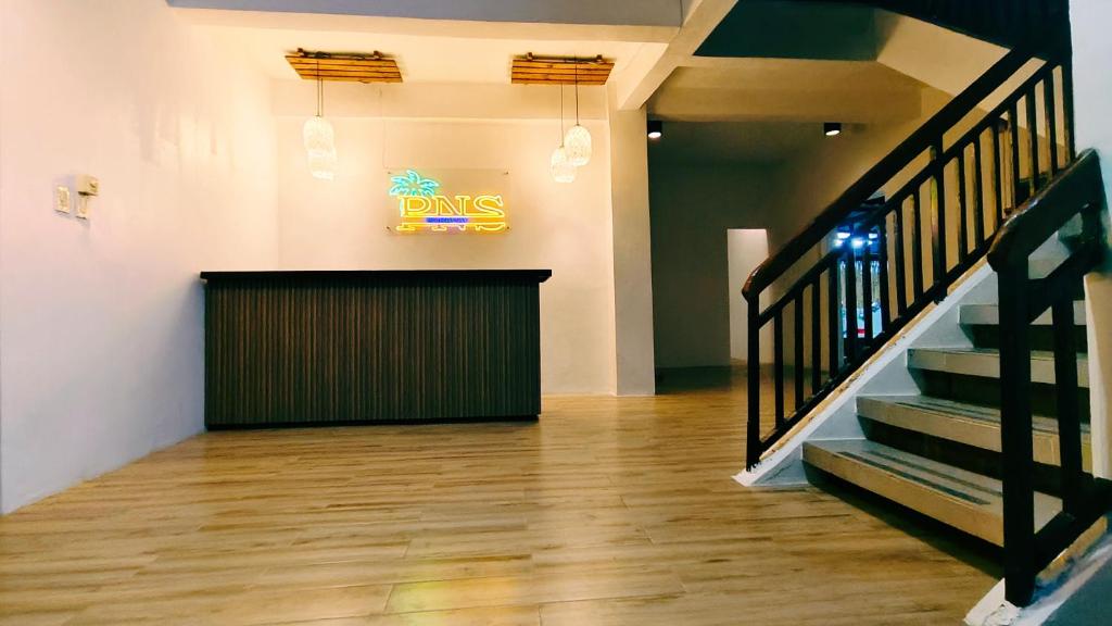 a dining room with a dines sign on the wall at PNS BORACAY Station 1 in Boracay