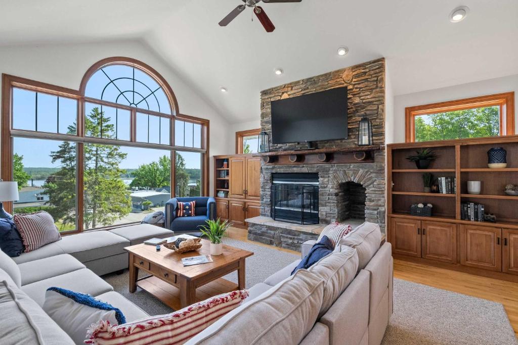a living room with couches and a fireplace at Bluff Haven by Simple Life Rentals in Fish Creek