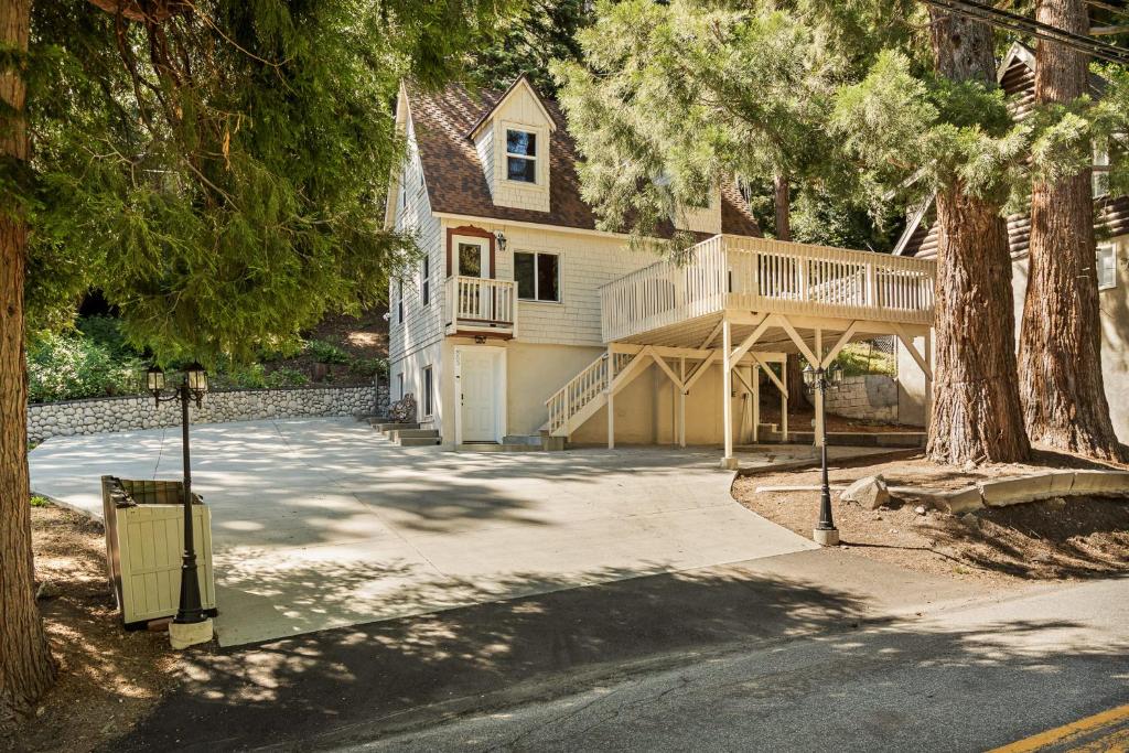 a house with a large deck on the side of it at SPSL Lake Arrowhead llc in Lake Arrowhead