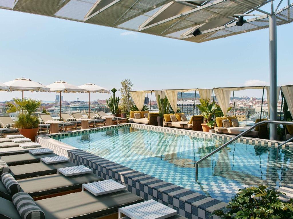 a swimming pool on the roof of a building at The Hoxton, Poblenou in Barcelona