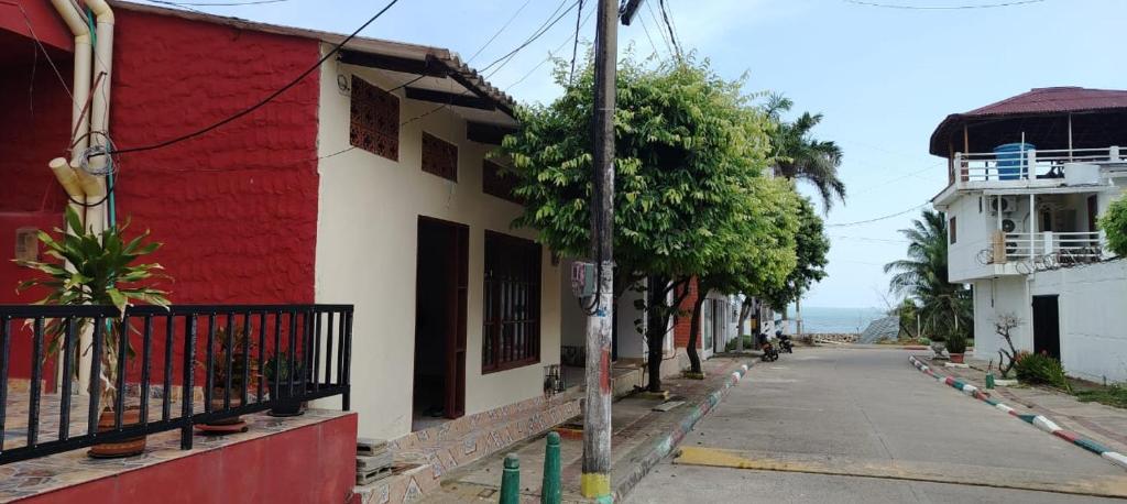 an empty street with a red and white building at Apartamento Brisa y Mar 2 in Arboletes