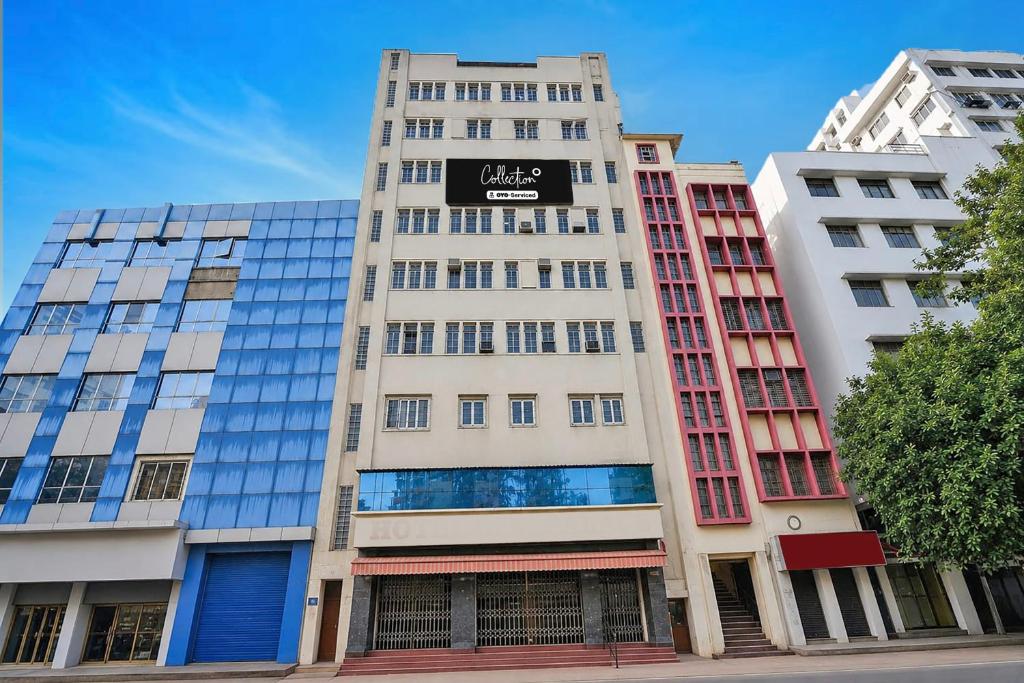a tall building with a sign on the side of it at Super Collection O Dalhousie Square Kolkata Formerly G.N Palace in Calcutta Bara Bazar