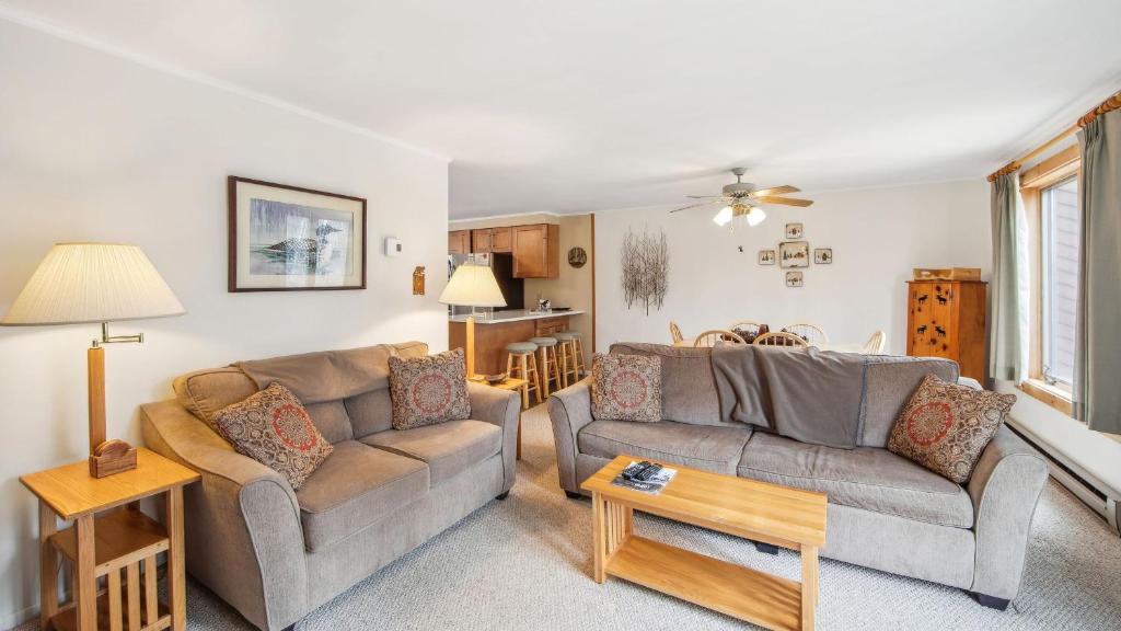 a living room with two couches and a table at Arena by AvantStay in North Creek