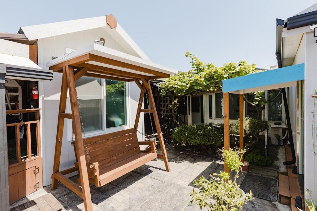 a house being constructed with awning on a patio at Pyeonanhan Guesthouse in Hamdŏng-ni