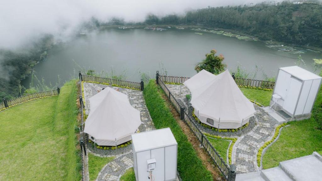 an aerial view of tents next to a lake at Telaga Menjer Glamping 2 in Kejajar