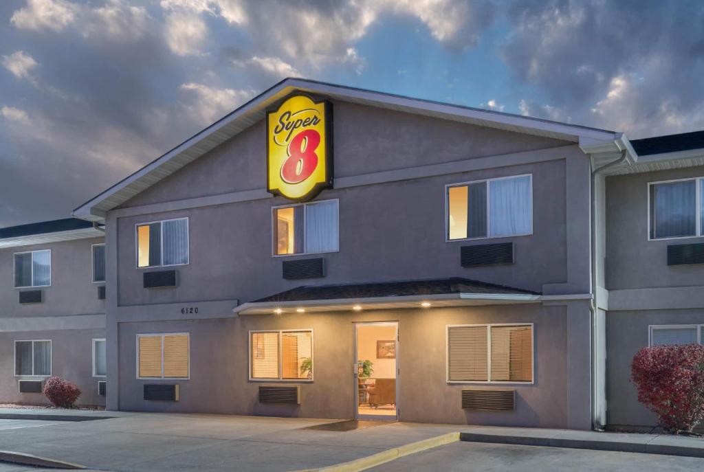 a building with a sign on the side of it at Super 8 by Wyndham Fountain in Fountain