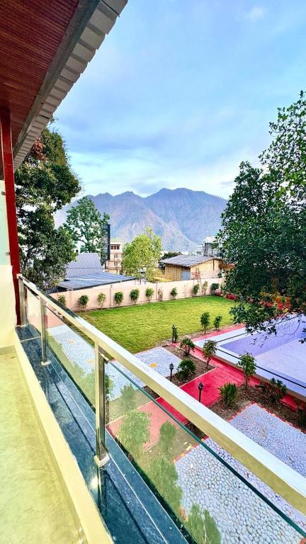 a balcony with a view of a park at Boho Stays Rishikesh in Rishīkesh