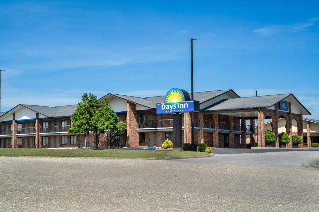 a hotel with a sign for a casino at Days Inn by Wyndham Clanton AL in Clanton