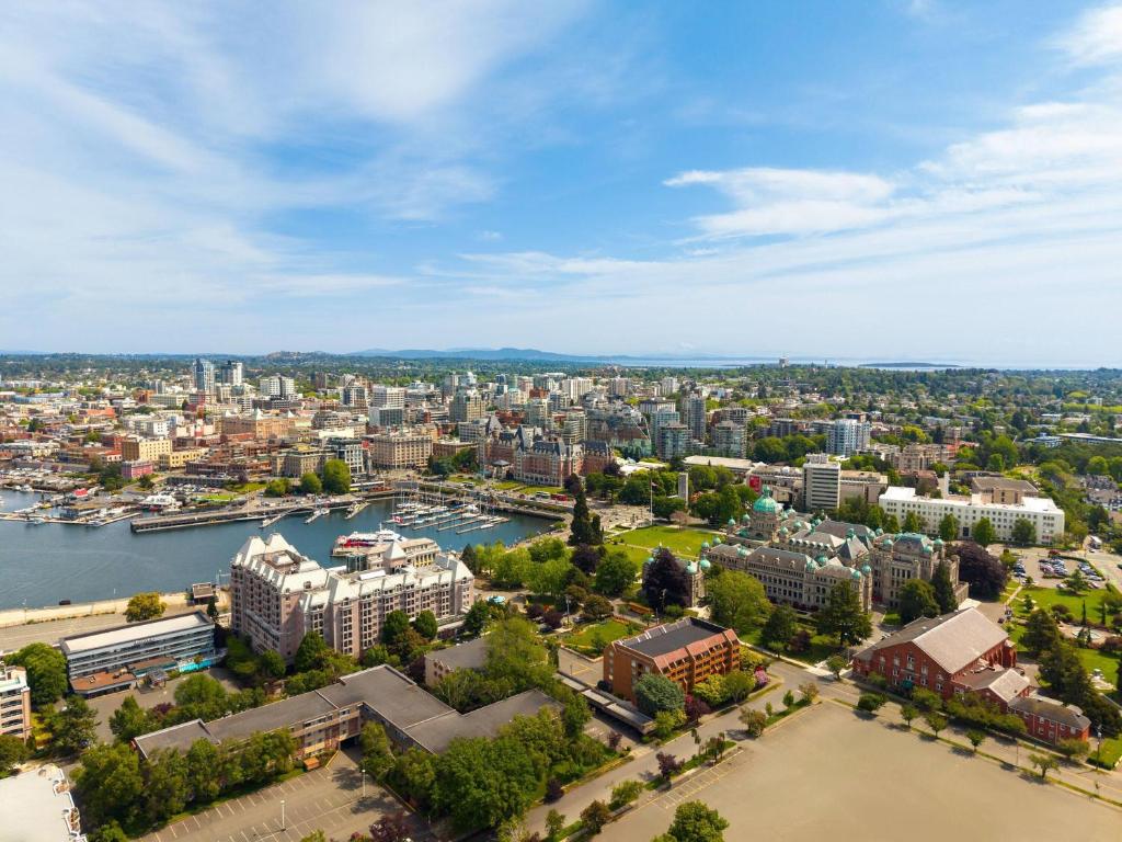 an aerial view of a city with a river and buildings at Royal Scot Hotel & Suites, Trademark Collection by Wyndham in Victoria