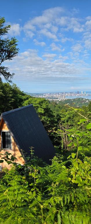 a roof of a house on a hill with trees at Cottage Sunset 2 in Sakhalvasho