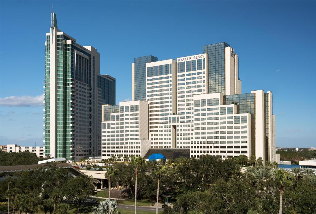 a group of tall buildings in a city at Hyatt Regency Orlando in Orlando