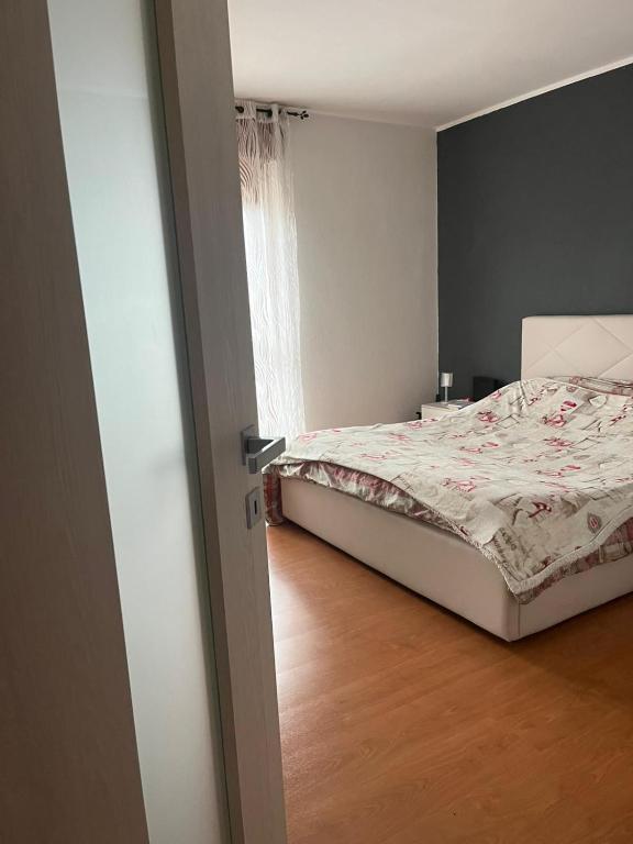 a bedroom with a bed and a window at San Francisco in Borgo San Dalmazzo