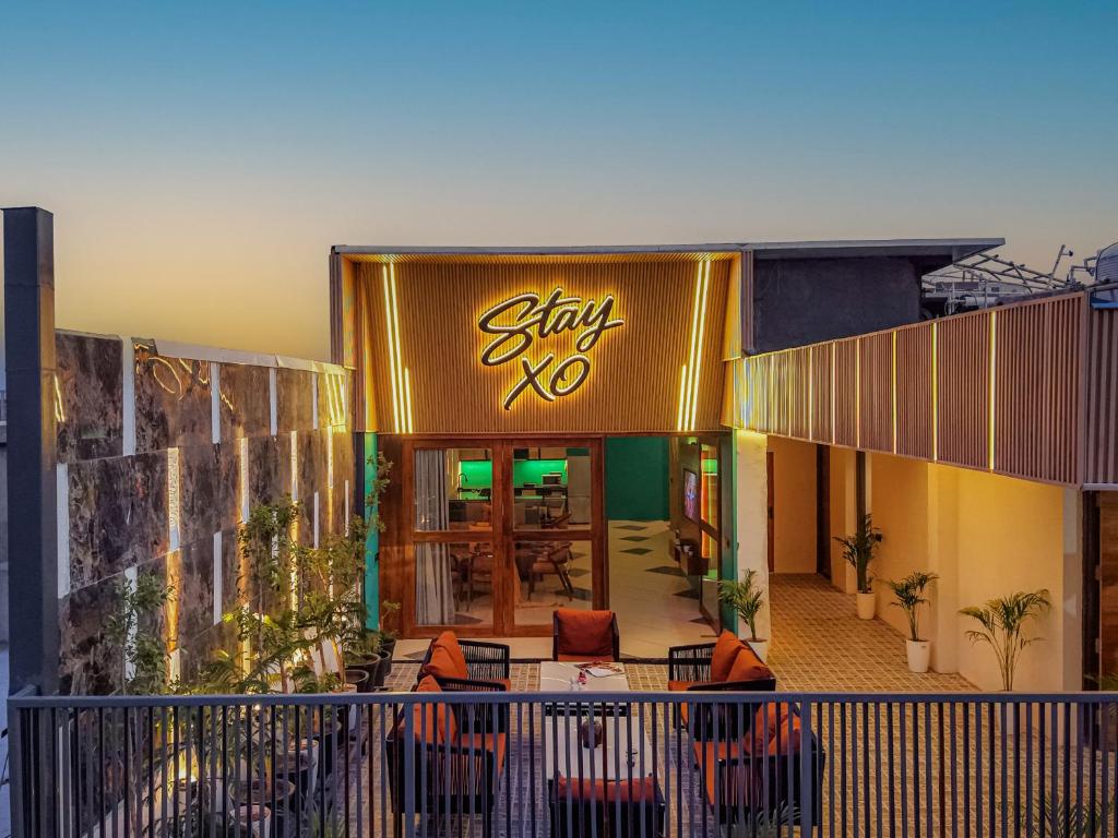 a building with a sign that reads stay at Stay XO - A Luxurious 3BHK Villa in Panchkula in Panchkula
