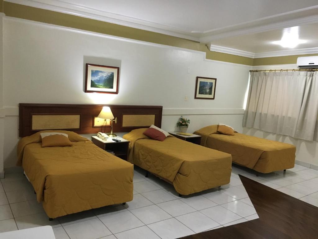 Postel nebo postele na pokoji v ubytování Tamareiras Park Hotel