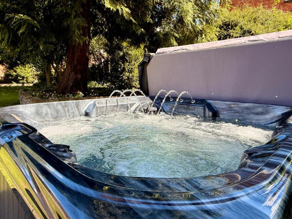 a pool of water with a water slide at West View in Broughton