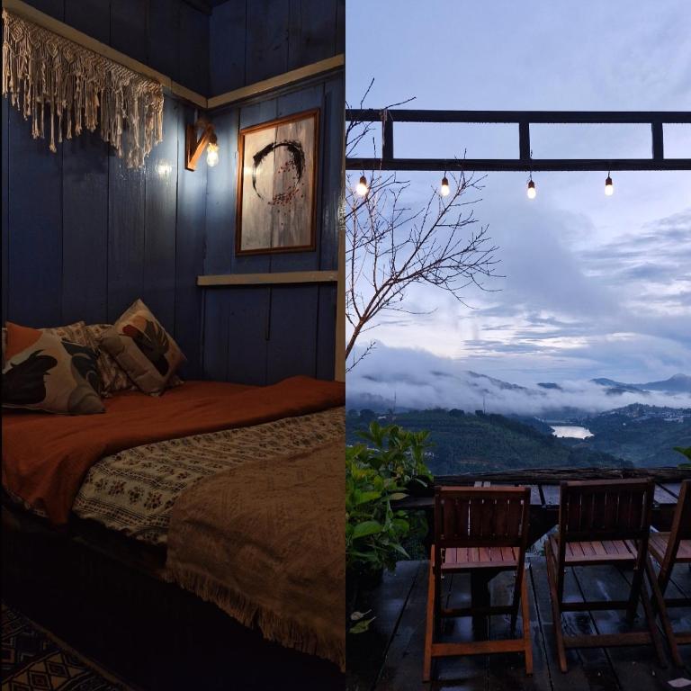 a bedroom with a bed and a view of the mountains at Nhiên Café & Homestay in Xuân Trường