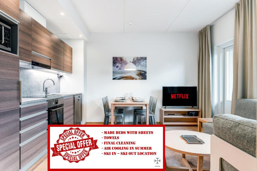 a kitchen and dining room with a sign that reads specialoffer at RukaHillChalet3 Ski In - Ski Out in Ruka